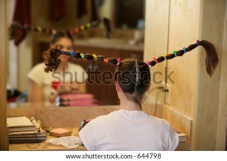 girl fixing silly hair giant pigtails