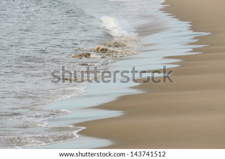 clean sand beach and ocean waves in Charleston Oregon on the Pacific Ocean near Coos Bay