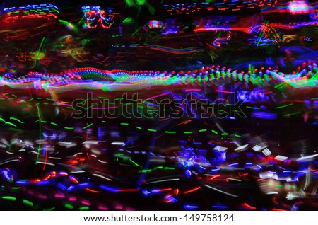 Color neon streaks of light glow sticks at a night celebration