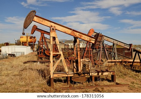 pumpjack, nodding donkey, horsehead, rocking horse, dinosaur, sucker rod, Big Texan, thirsty bird, or jack pump is the overground drive for a reciprocating piston pump in an oil well. in eastern Texas