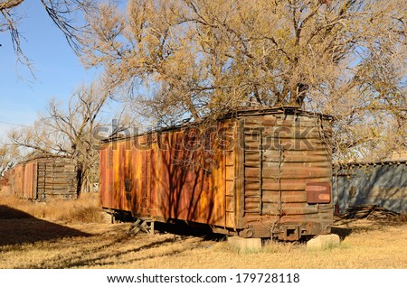 Old railroad box car being used as a storage outbuilding shed in northern Texas
