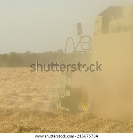 Combine working a newly cut field of summer wheat in the Willamette Valley of Oregon