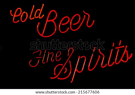 Cold beer and fine spirits neon sign in a bar window