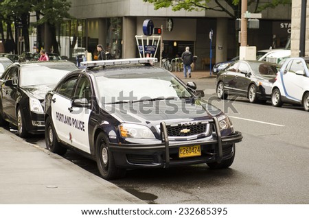 PORTLAND, OR, USA - SEPTEMBER 24, 2014:  A Portland Oregon police cruiser or car sits in the downtown area near the courthouse.