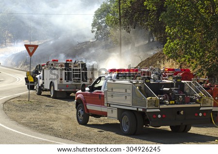 Roseburg, OR, USA - July 6, 2014: Fire brush rigs or type 3 wildland engine at a natural cover fire.