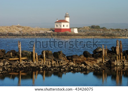 Coquille River Lighthouse, also called Bandon Light, in Bullards Beach State Park.  Built in 1896, it sits across the Coquille River bay from Bandon OR.  Photo taken from the South Jetty area.