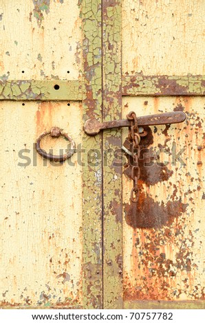 Detail of and old padlock and chain of a old commercial building in the old downtown area of Harrisburg Oregon