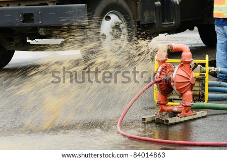 Pumping water out of the excavation hole to repair a 12 inch water main failure on Harvard Ave in Roseburg OR