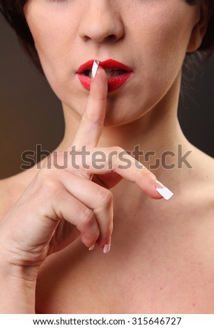 woman without dress with finger at the mouth