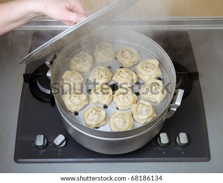 Manti (Central Asian meat dumplings, similar to baozi) in a steam cooker