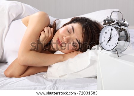 Beautiful woman over sleeping in bed