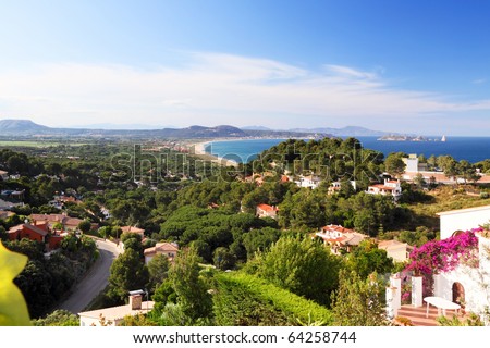 Panoramic landscape of recreational property, holiday second home in Spain, Europe - scenic view on residential houses, Mediterranean sea and mountains.
