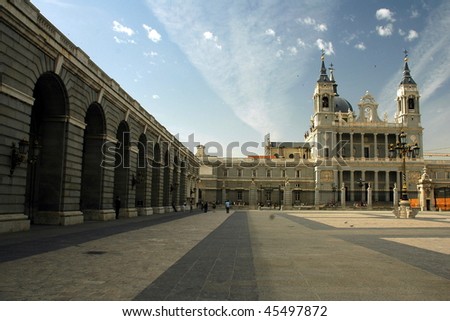 Madrid palace in sunny day with blue sky covered by cloud.