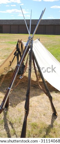 Union military soldiers rifles reenactment displayed at a fort outside.