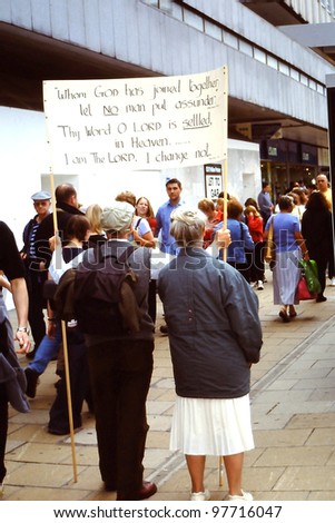 SEATTLE, WA--JANUARY 1:  Mormon church members walk the street with a sign protesting the high divorce rate in  Seattle, WA on January 1, 2008.