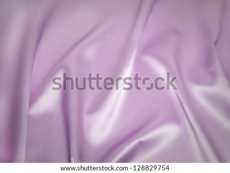 Purple or lavender satin fills the frame.  Excellent for backgrounds.  Copy space.