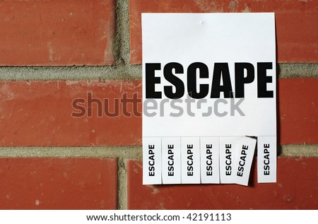 Lonely Escape ad on the red brick wall