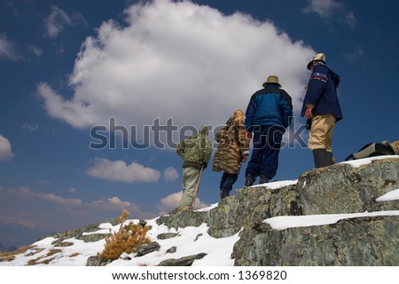 Climbers, mountains and blue sky. Altay, Russia.
