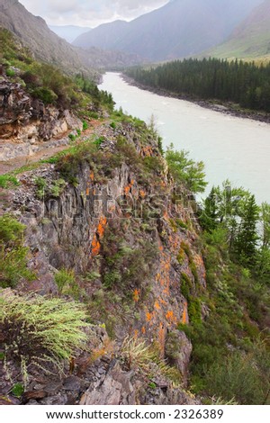 Road, mountains and river. Altay. Russia.