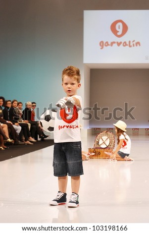 MOSCOW-SEPTEMBER 5:Unidentified children show children\'s shoes garvalin Spanish companies at  the International Fashion Fair on September 5, 2011 in Moscow