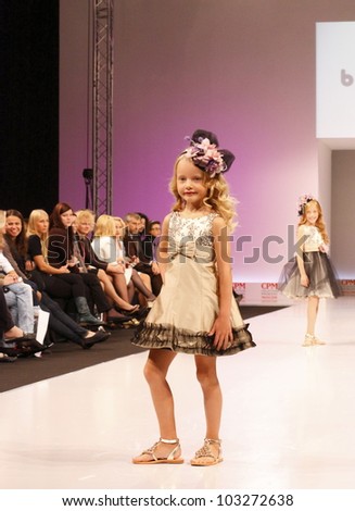 MOSCOW-SEPTEMBER 5:Unidentified children show a festive clothes barcarola Spanish brand on the international  Fashion Fair on September 5, 2011 in Moscow