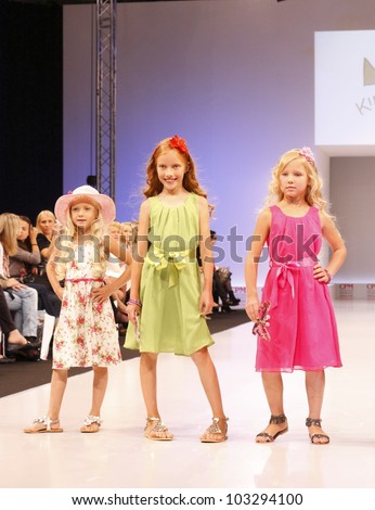 MOSCOW-SEPTEMBER 5:Unidentified children show holiday clothing brand KINDERIT Finland at the International Fashion Fair on September 5, 2011 in Moscow