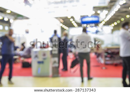 Trade show people, intentionaly blurred background