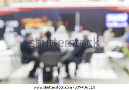 Trade show people, intentionally blurred image