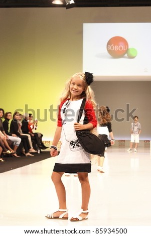 MOSCOW-SEPTEMBER 5: An unidentified child model walks down the runway wearing Spanish brand Boboli collection premiere Moscow Kids at  the International Fashion Fair on September 5, 2011 in Moscow, Russia.