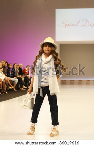 MOSCOW-SEPTEMBER 5:An unidentified model  walks down the runway wearing Italian brand Special Day collection premiere Moscow Kids at  the International Fashion Fair on September 5, 2011 in Moscow, Russia.