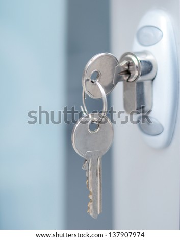 Door lock witj keys macro shot - Real estate concept