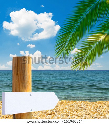 Tropical beach with empty wooden sign - Vacation concept