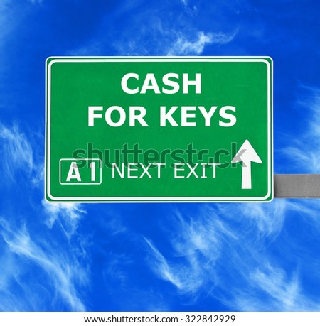CASH FOR KEYS road sign against clear blue sky