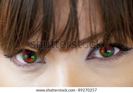 Multicolored woman eyes macro shot