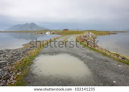 Water puddle on road at Norwegian coast
