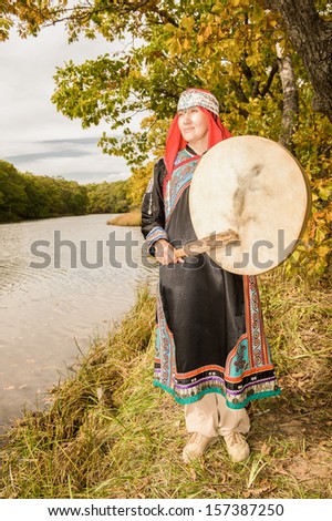 The young woman does a ceremony of a sort of Udege to spirits of water...