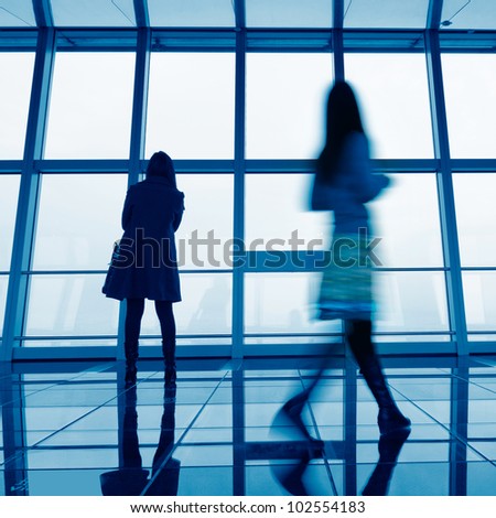 image of People silhouettes at morden office building