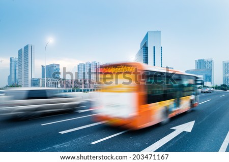 driving bus in city traffic in motion blur