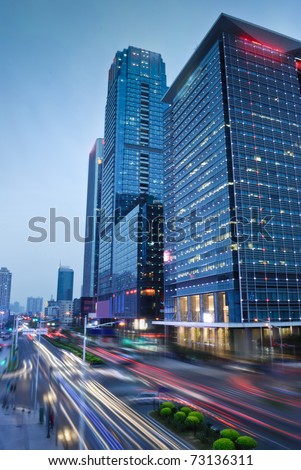 perspective view to glass high-rise building skyscrapers at night