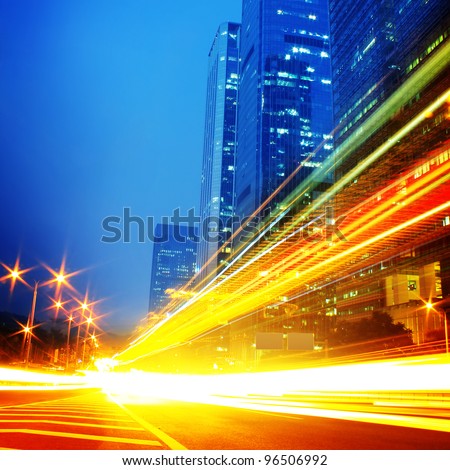 the light trails on the modern building background in city