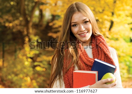 Young college girl portrait smiling at camera