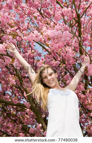 Flying woman in cherry blossom