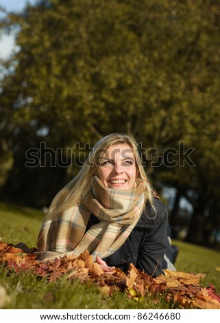 Young beautiful women enjoying nice autumn weather in park