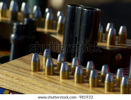 Shells and guns at a cowboy shooting competition.