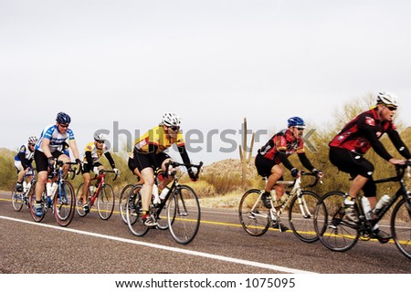 Competitors in a bike race through the desert.