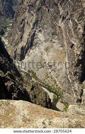 a scenic view of the Gunnison River and painted wall in Black Canyon of the Gunnison National Park