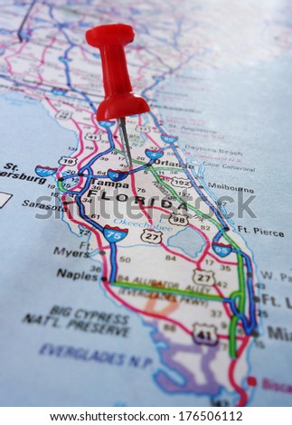 Closeup of a Florida map with a red push pin