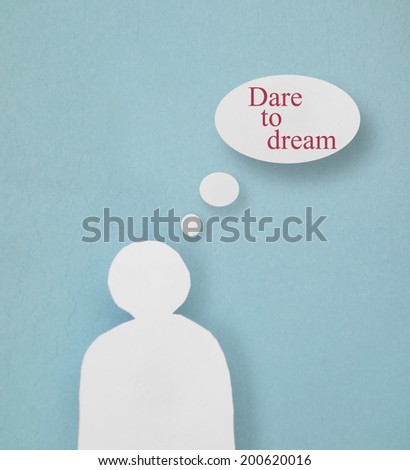 Paper person cutout with Dare To Dream thought bubbles