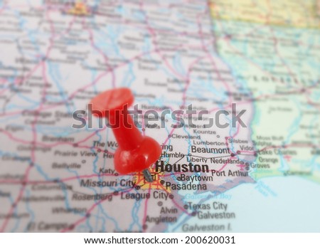 Closeup of a map of Houston, Texas with magnifying glass