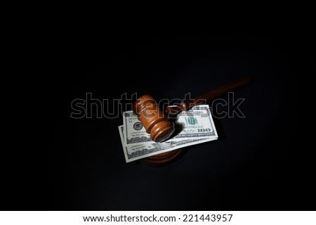 Judges court gavel and hundred dollar bills
